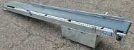 280 x 2900 mm. Make Soco, galvanised frame, cleated belt. Gear motor under the belt, so it can run both ways. Side guide on one side.